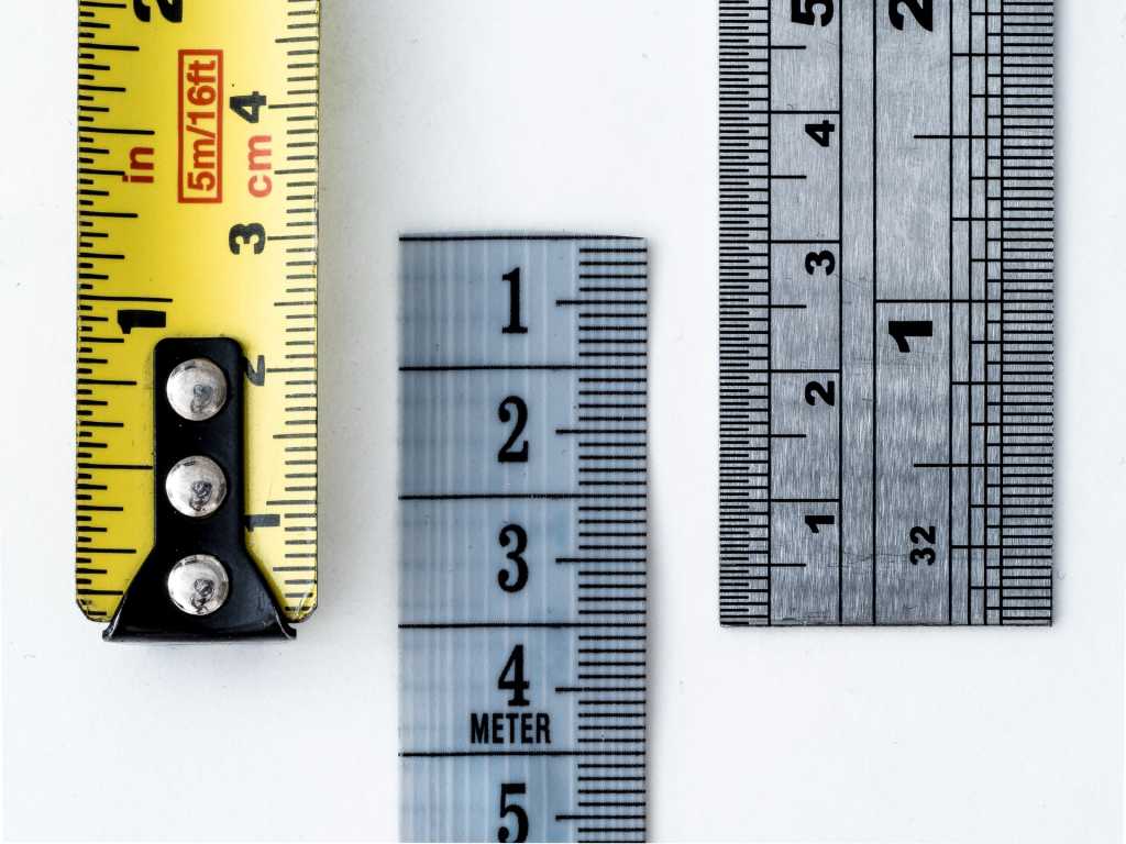 close up of metal rulers and take measure